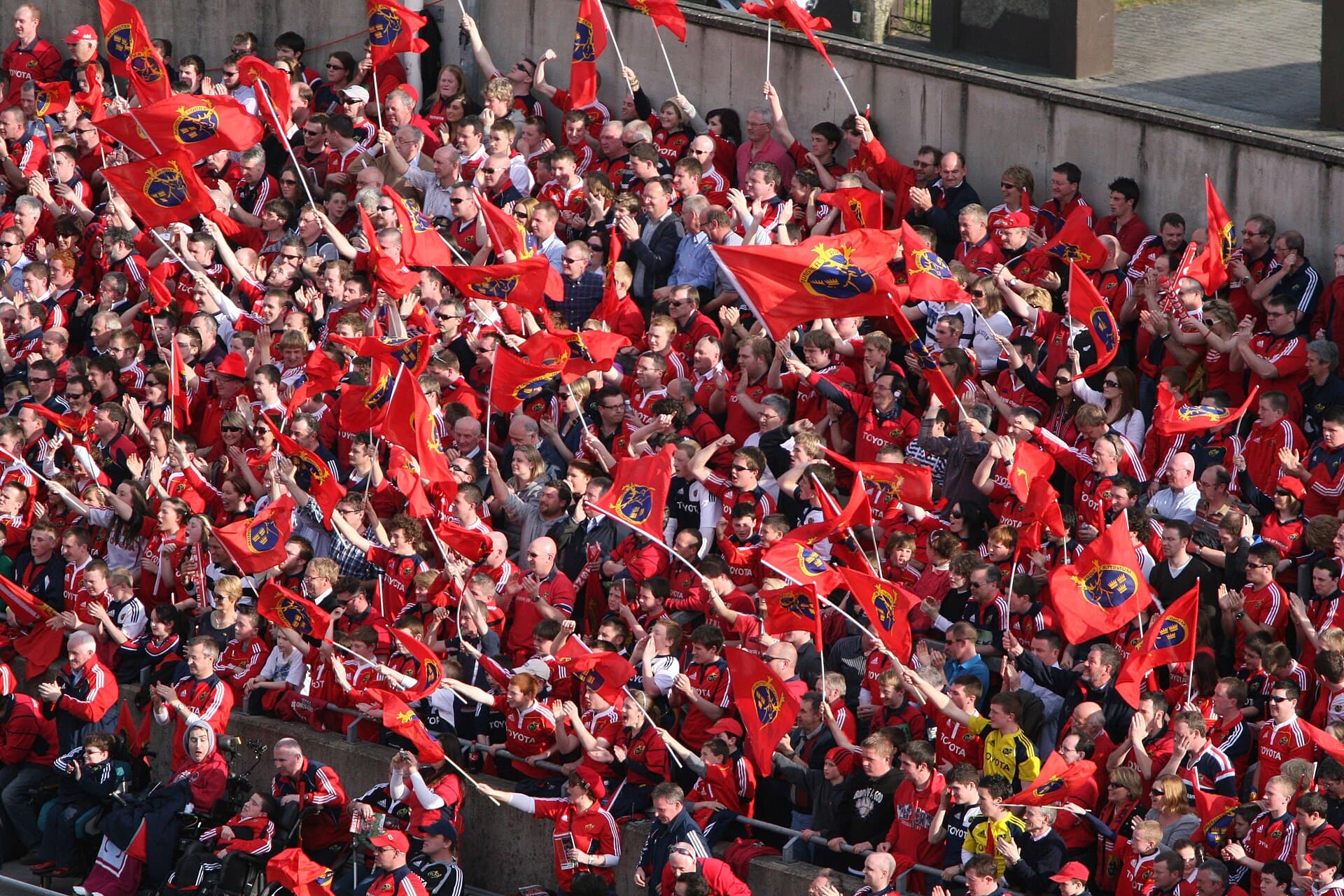 Munster fans waving red flags at Thomond Park