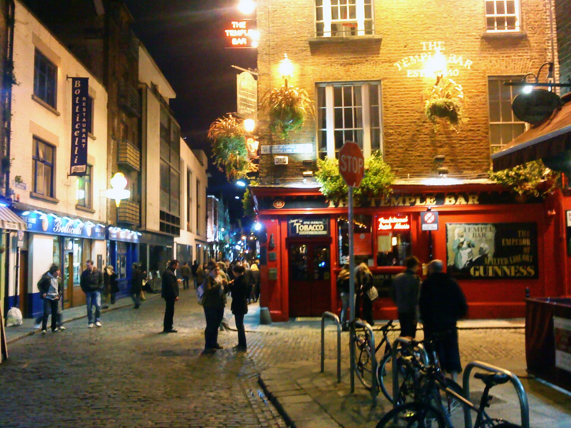 The Temple Bar pub lit up at night in Dublin